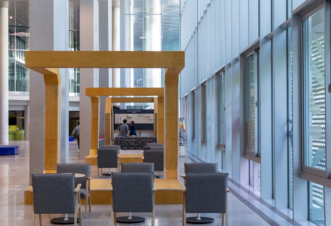 There are tables and chairs in the lobby of ACC Library Park.